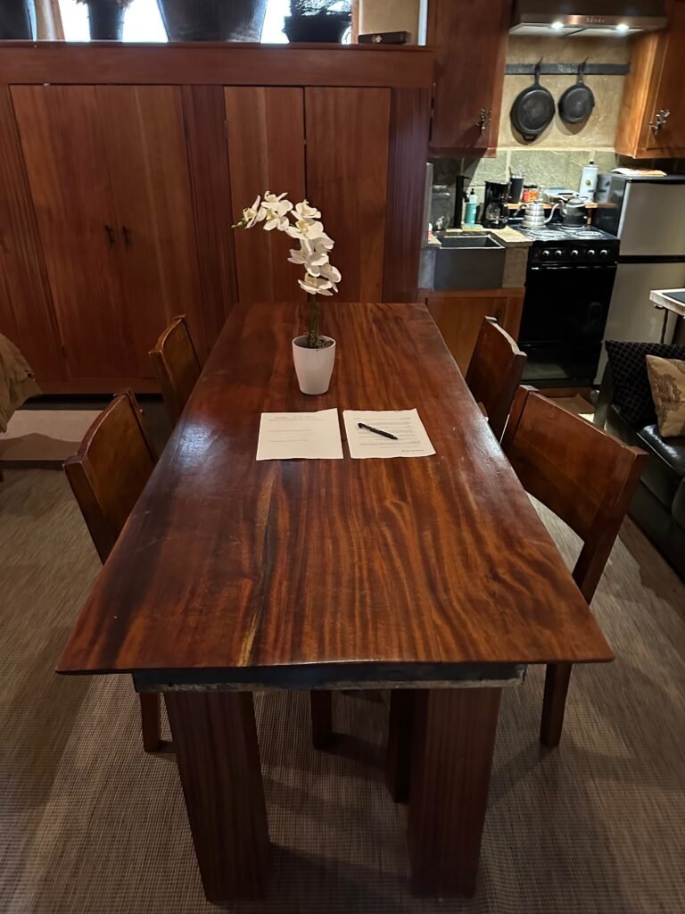 a wooden table in the adobe