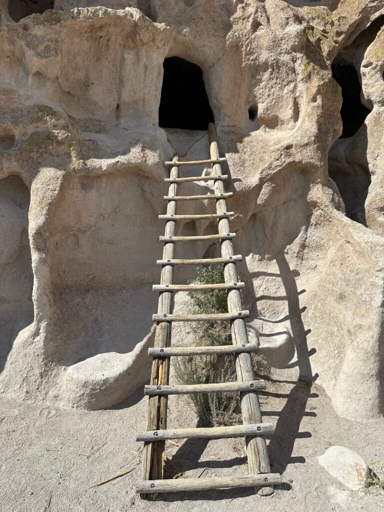 a ladder leading into a cliff dwelling